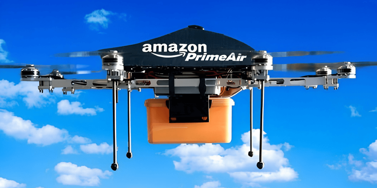 Amazon Prime Air drone flying against a blue sky carrying an orange package