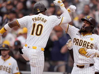 Two San Diego Padres players celebrate a home run during a game