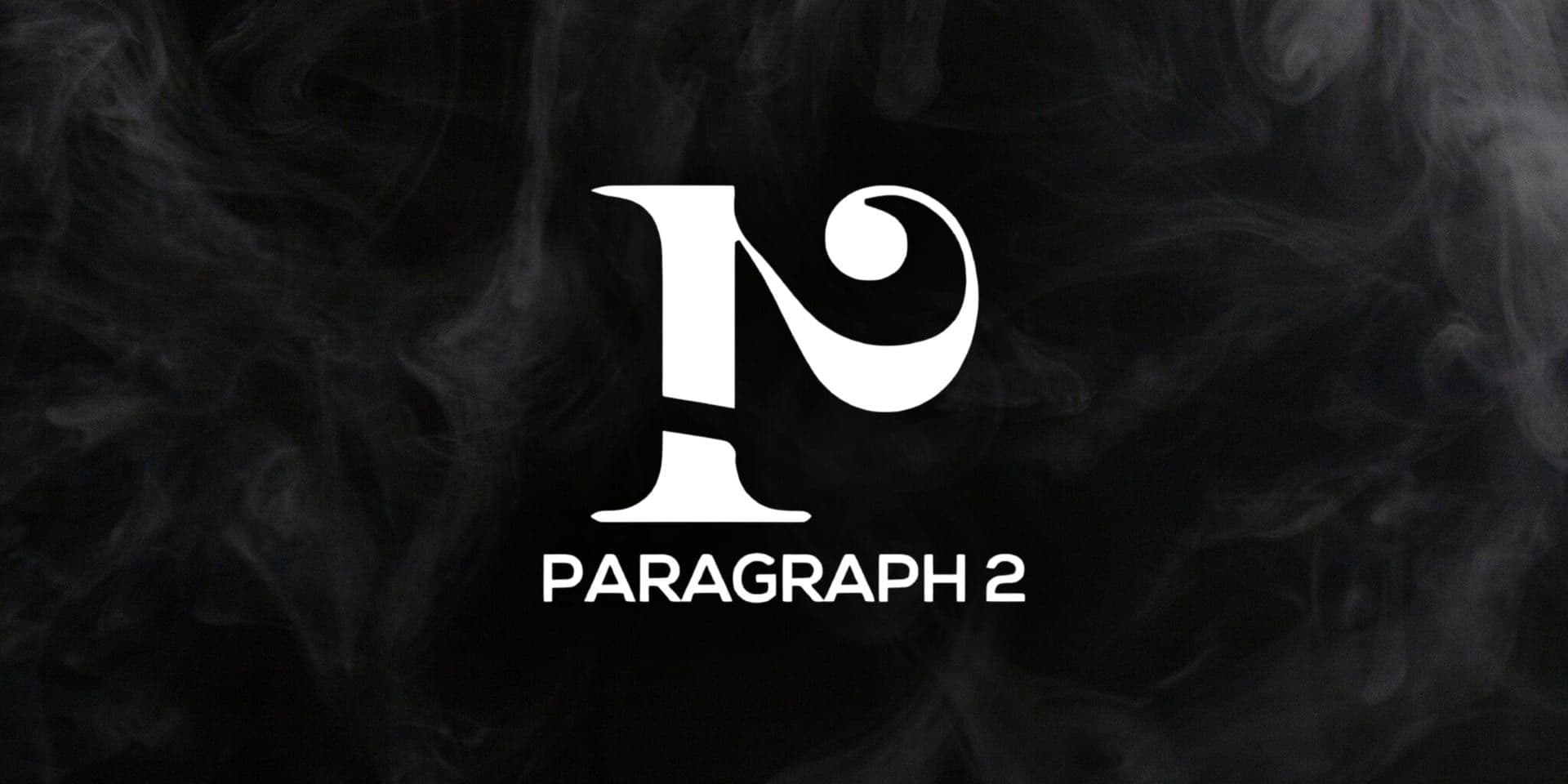 White Paragraph 2 logo centered on a dark smoky background.